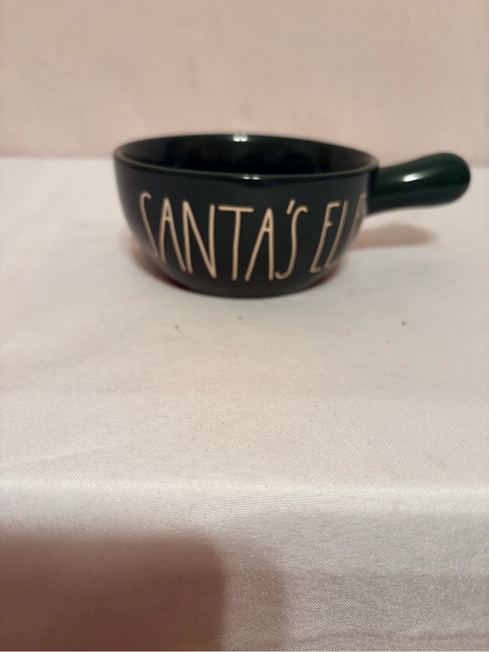 Rae Dunn Christmas "SANTA'S ELF" ceramic soup bowl with a handle.